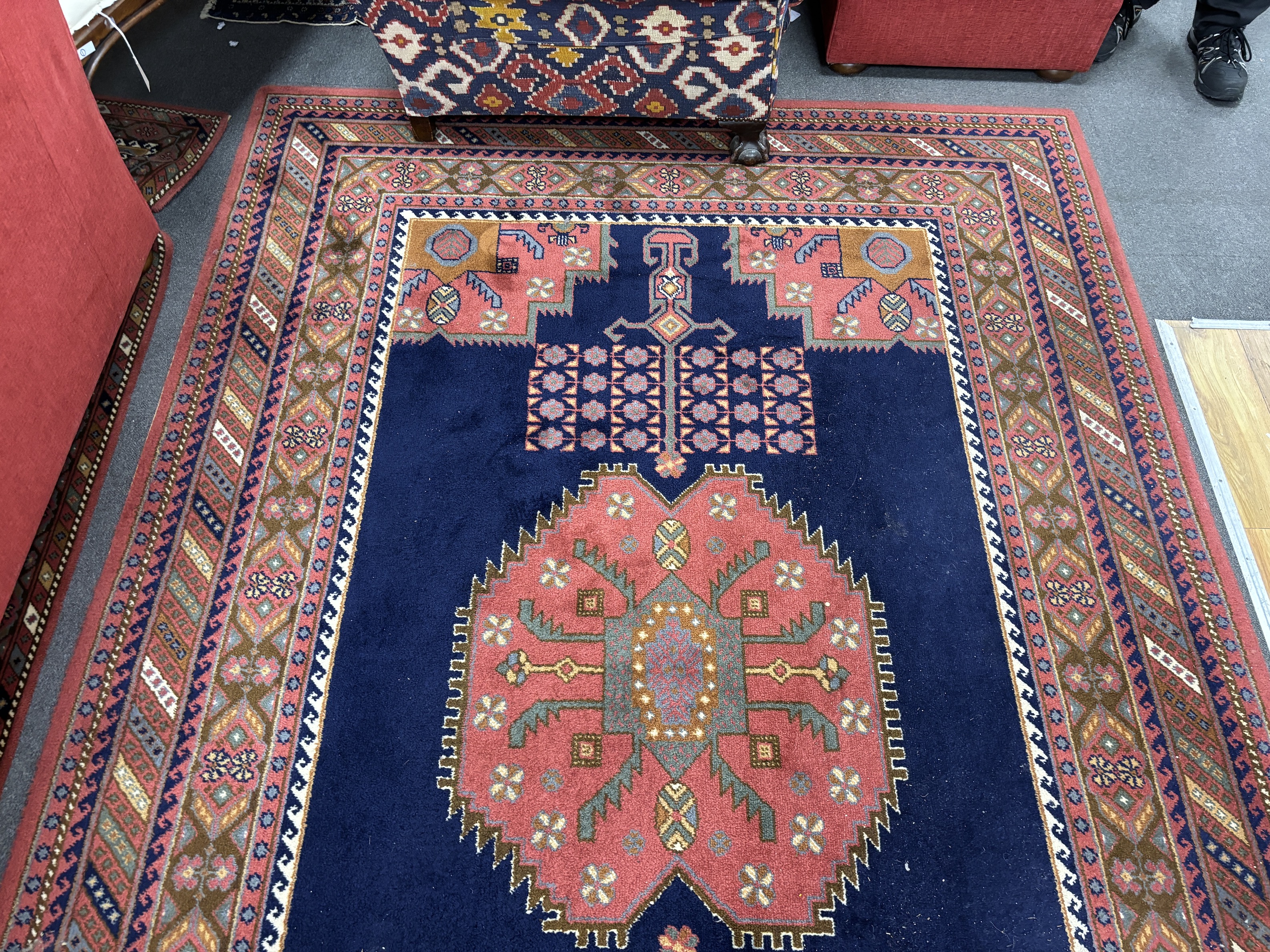 A North West Persian style machined blue ground carpet together with a similar runner, larger 295 x 190cm